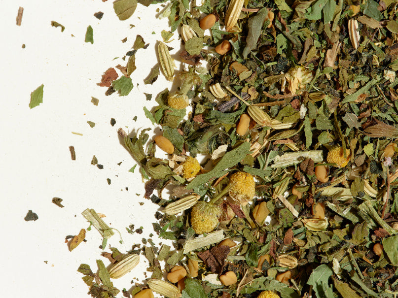 New Mama loose leaf tea leaves on a flat surface.